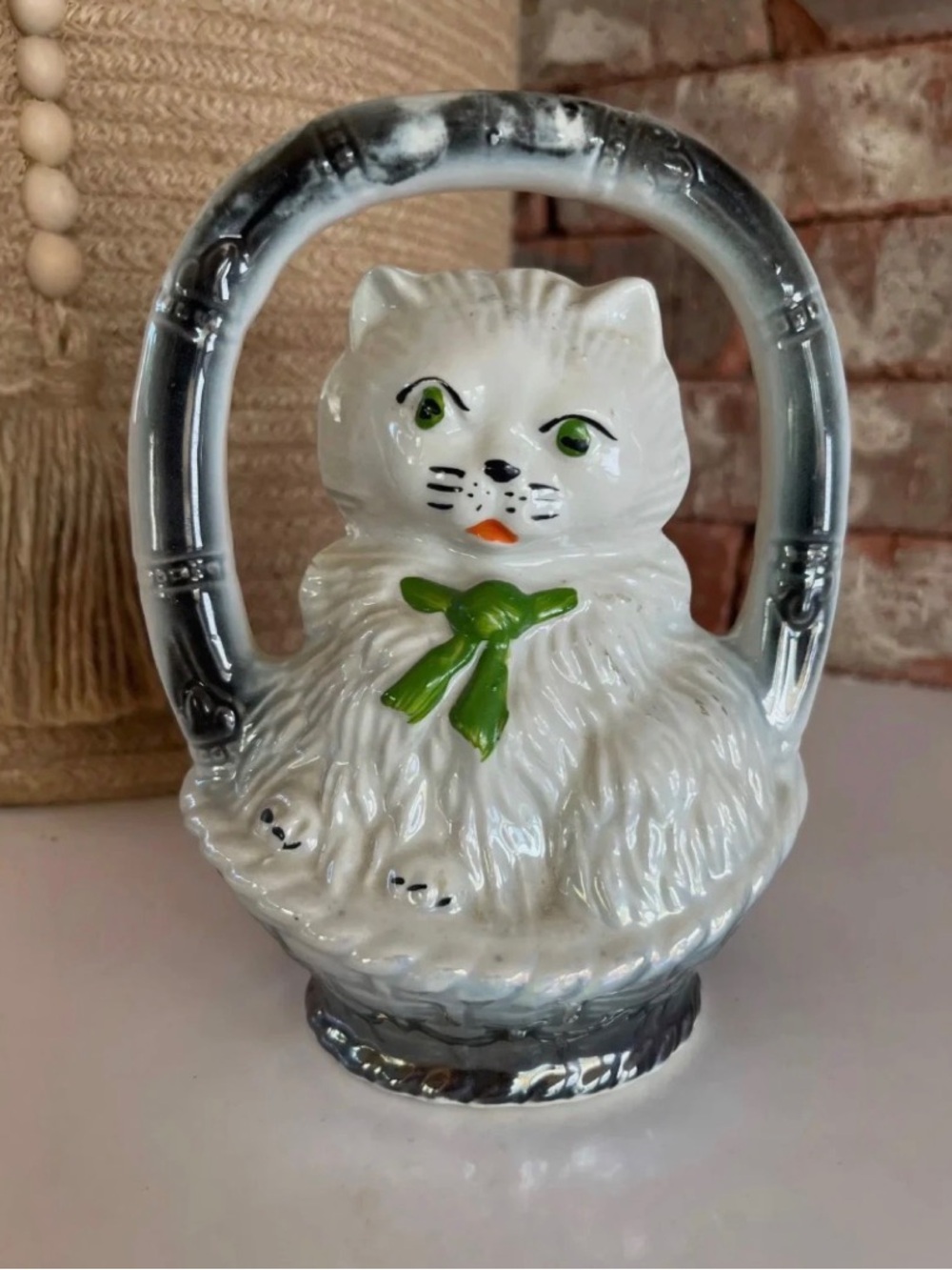 Vintage 1950’s Japan White Ceramic Cat Figurine with Green Bow and Silver Handle